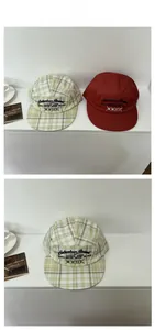 Detail view of 5-panel street style caps with check pattern and embroidery