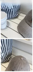 Detail view of a vintage dark grey plaid baseball cap with premium twill cotton fabric