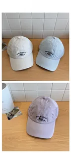 Detailed embroidery of cute bear and lettering on cotton baseball caps in various colors