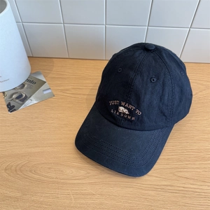 Black cotton baseball cap featuring cute bear embroidery and Just Want To Lie Down text
