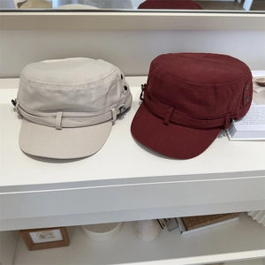 Washed cotton cadet hats in beige and wine red with vintage metal buckle details