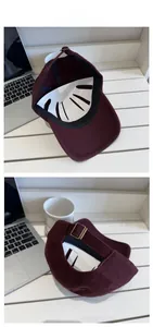Detail of adjustable metal buckle and internal structure of burgundy baseball cap