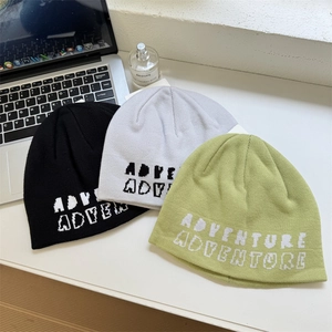 American street style knit beanies with ADVENTURE lettering in black, grey, and green