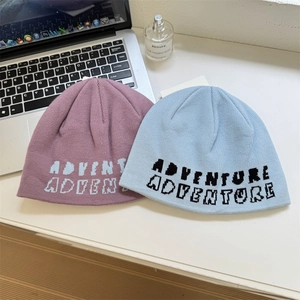 Street style jacquard knit beanies in purple and blue with adventure letter patterns