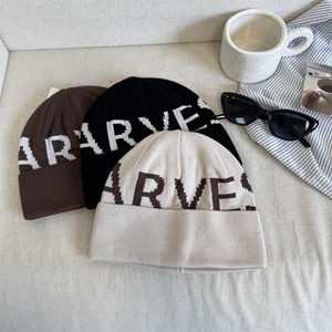 Vintage jacquard knit beanie with HARVEST text in brown, black and cream colors