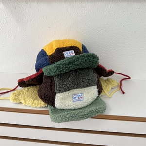 Colorful plush pilot hat for women with earflaps and warm fleece patchwork design