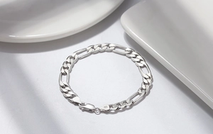 Detail of S925 silver Figaro chain bracelet with S925 ITALY hallmark stamp