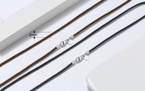 Detailed close-up of 2mm black leather necklace cord with S925 sterling silver lobster clasp