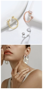Detalle de los anillos abiertos con circonitas talla pera en acabados oro, plata y rosa