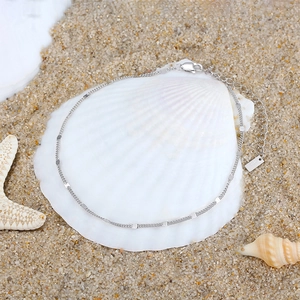 Detailed view of S925 sterling silver 1.2mm spacer chain with lobster clasp and shell