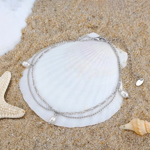 Minimalist S925 sterling silver double layer anklet with pearls on a beach seashell
