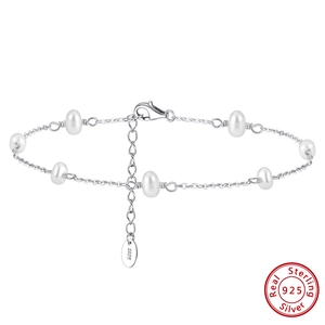 Macro detail of S925 sterling silver chain with baroque pearls and lobster clasp