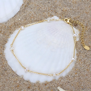 S925 sterling silver gold anklet with 3-3.5mm baroque pearls on white sea shell background