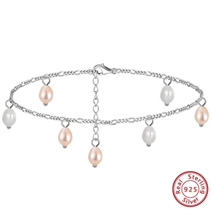 Detail of S925 sterling silver anklet with real pearls and Figaro chain links