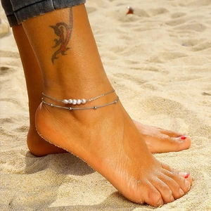 Double-layered S925 sterling silver anklet with pearls on a sandy beach background