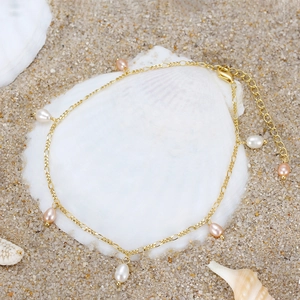 S925 sterling silver anklet with freshwater pearls on a shell at the beach