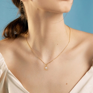 Elegant 925 sterling silver necklace with a water drop pearl pendant on a gold chain
