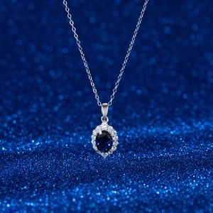 Elegant S925 sterling silver necklace with oval sapphire pendant and cubic zirconia halo