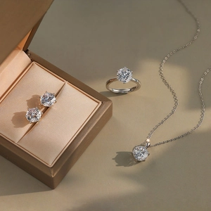 Close-up of S925 silver jewelry set with princess cut cubic zirconia and brown silk box