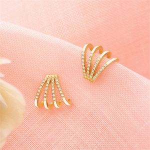 Detailed macro of 14k gold plated S925 sterling silver four-row pavé zircon earrings