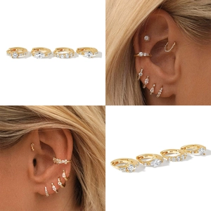 Lot de quatre créoles en argent sterling 925 doré avec des zircons de formes variées
