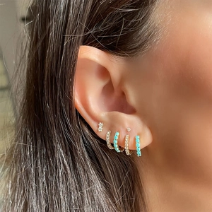 S925 silver stud earrings set with turquoise stones and zircons on model ear