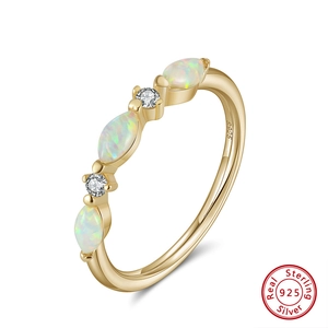 Detail of 925 sterling silver ring featuring marquise opal and round zircon stones