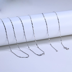 Macro shot of S925 sterling silver long-bar link chain with polished geometric facets