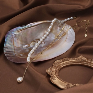 Three-layer S925 sterling silver necklace with natural freshwater pearls on silk fabric