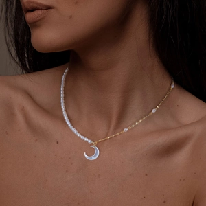S925 sterling silver necklace with freshwater pearls and a crescent moon shell pendant