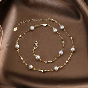K-gold plated S925 silver necklace featuring natural freshwater pearls on brown satin