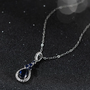 Collier avec pendentif saphir bleu poire en argent 925 et halo de zircons étincelants