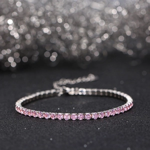 Macro shot of 925 silver tennis bracelet with pink cubic zirconia and lobster clasp