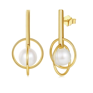 Macro shot of gold geometric pearl drop earrings featuring round freshwater pearls