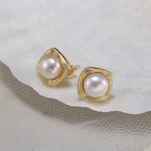 Elegant gold square pearl earrings with matte finish and tiny crystal accents