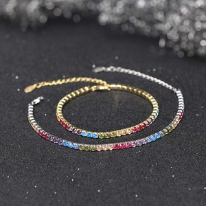 Detailed close-up of rainbow cubic zirconia tennis bracelets in gold and silver plating