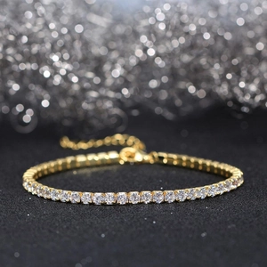 Macro view of gold plated 925 silver tennis bracelet with cubic zirconia and lobster clasp