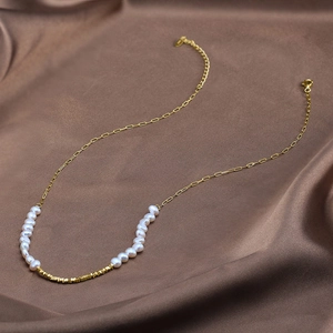 Baroque freshwater pearl and 14K gold plated silver link necklace on brown silk fabric