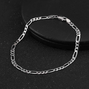Classic 3.3mm 925 sterling silver Figaro chain bracelet with lobster clasp on black background