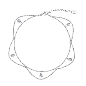 Detail of silver double-layered anklet with round zircons and S925 engraved clasp