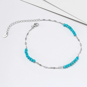Elegant S925 sterling silver anklet featuring faceted turquoise beads and butterfly chain