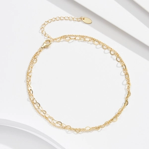 Detail of double-layer gold chain with heart links and adjustable lobster clasp