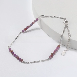 Detailed view of S925 sterling silver anklet with purple beads and lobster clasp closure