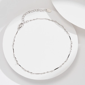 S925 sterling silver twisted chain anklet with lobster clasp on a white display stand