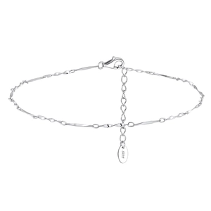Macro detail of S925 sterling silver twisted chain anklet with lobster clasp and tag