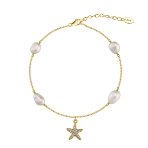 Detail of S925 sterling silver anklet with freshwater pearls and zircon starfish charm