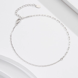 Detail of S925 sterling silver paperclip and cross chain link with lobster clasp