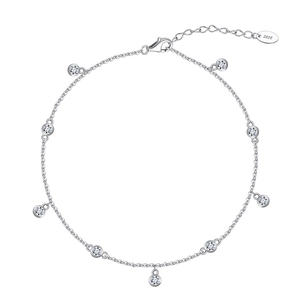 Close-up of S925 sterling silver anklet with nine sparkling zircon charms and lobster clasp