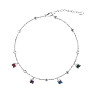 Macro detail of S925 sterling silver anklet with square colorful zircon gemstone pendants