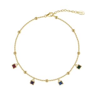 Close-up of S925 sterling silver anklet with square colorful zircons and gold beads